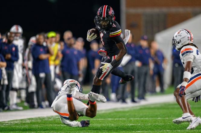 Sep 15, 2023; College Park, Maryland, USA; Maryland Terrapins wide receiver Shaleak Knotts (4) is tackled during the second quarter against the Virginia Cavaliers at SECU Stadium. Mandatory Credit: Reggie Hildred-USA TODAY Sports
