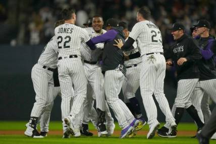 Sep 15, 2023; Denver, Colorado, USA; Colorado Rockies first baseman Elehuris Montero (44) and Colorado Rockies left fielder Nolan Jones (22) and Colorado Rockies designated hitter Kris Bryant (23) celebrate defeating the San Francisco Giants in the ninth inning at Coors Field. Mandatory Credit: Ron Chenoy-USA TODAY Sports
