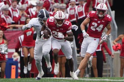 Sep 16, 2023; Madison, Wisconsin, USA; Wisconsin Badgers cornerback Jason Maitre (23) returns an interception against Georgia Southern Eagles during the second quarter at Camp Randall Stadium. Mandatory Credit: Mark Hoffman-USA TODAY Sports