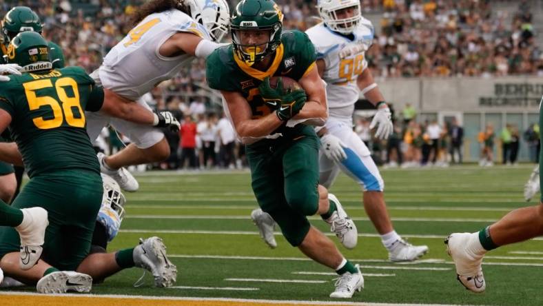 Sep 16, 2023; Waco, Texas, USA;  Baylor Bears running back Dawson Pendergrass (35) scores on a touchdown run against the Long Island Sharks during the first half at McLane Stadium. Mandatory Credit: Chris Jones-USA TODAY Sports