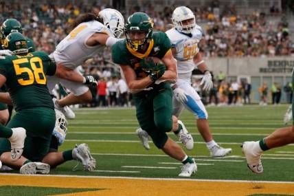 Sep 16, 2023; Waco, Texas, USA;  Baylor Bears running back Dawson Pendergrass (35) scores on a touchdown run against the Long Island Sharks during the first half at McLane Stadium. Mandatory Credit: Chris Jones-USA TODAY Sports