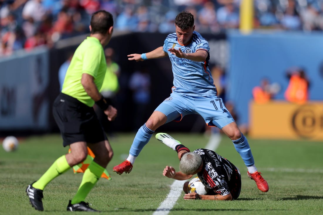 Sep 16, 2023; New York, New York, USA; New York Red Bulls defender John Tolkin (47) and New York City FC midfielder Matias Pellegrini (17) fight for the ball during the first half at Yankee Stadium. Mandatory Credit: Brad Penner-USA TODAY Sports