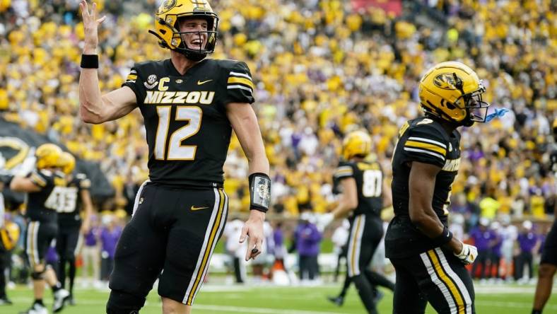 Sep 16, 2023; Columbia, Missouri, USA; Missouri Tigers quarterback Brady Cook (12) and wide receiver Luther Burden III (3) celebrate after a touchdown during the second half against the Kansas State Wildcats at Faurot Field at Memorial Stadium. Mandatory Credit: Jay Biggerstaff-USA TODAY Sports