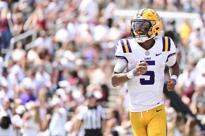 Sep 16, 2023; Starkville, Mississippi, USA; LSU Tigers quarterback Jayden Daniels (5) reacts after a play against the Mississippi State Bulldogs during the second half at Davis Wade Stadium at Scott Field. Mandatory Credit: Matt Bush-USA TODAY Sports