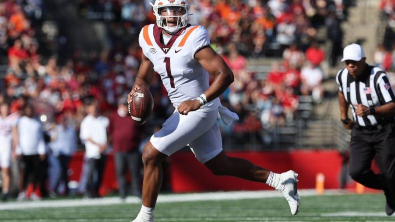 Sep 16, 2023; Piscataway, New Jersey, USA; Virginia Tech Hokies quarterback Kyron Drones (1) rolls out during the first half against the Rutgers Scarlet Knights at SHI Stadium. Mandatory Credit: Vincent Carchietta-USA TODAY Sports