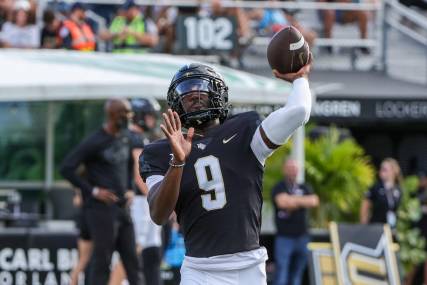 Sep 16, 2023; Orlando, Florida, USA; UCF Knights quarterback Timmy McClain (9) warms up before the game against the Villanova Wildcats at FBC Mortgage Stadium. Mandatory Credit: Mike Watters-USA TODAY Sports