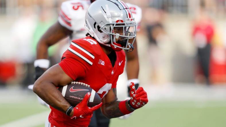 Sep 16, 2023; Columbus, Ohio, USA; Ohio State Buckeyes wide receiver Emeka Egbuka (2) runs for a touchdown during the second quarter against the Western Kentucky Hilltoppers at Ohio Stadium. Mandatory Credit: Joseph Maiorana-USA TODAY Sports