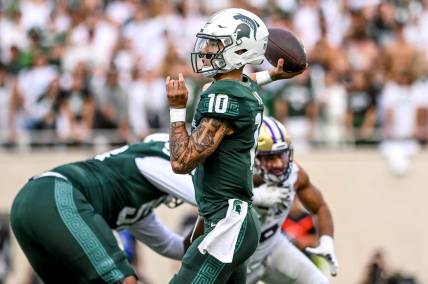 Michigan State's Noah Kim throws a pass against Washington during the second quarter on Saturday, Sept. 16, 2023, at Spartan Stadium in East Lansing.