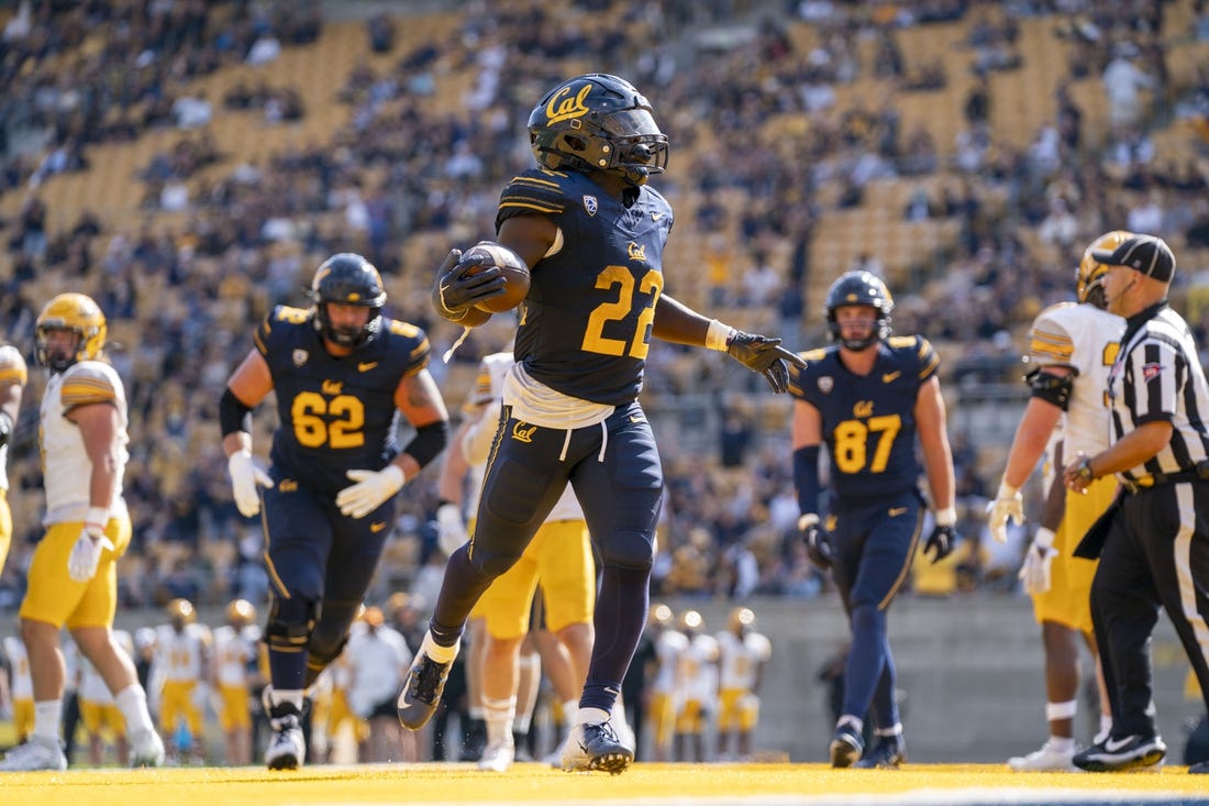 September 16, 2023; Berkeley, California, USA; California Golden Bears running back Isaiah Ifanse (22) scores a touchdown against the Idaho Vandals during the third quarter at California Memorial Stadium. Mandatory Credit: Kyle Terada-USA TODAY Sports