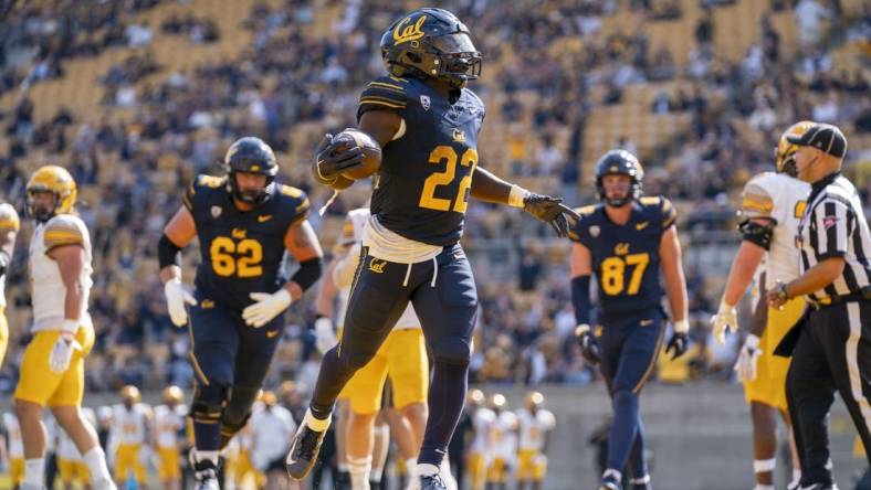 September 16, 2023; Berkeley, California, USA; California Golden Bears running back Isaiah Ifanse (22) scores a touchdown against the Idaho Vandals during the third quarter at California Memorial Stadium. Mandatory Credit: Kyle Terada-USA TODAY Sports