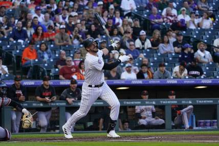 Sep 16, 2023; Denver, Colorado, USA; Colorado Rockies right fielder Kris Bryant (23) watches his RBI double to right field in the first inning at Coors Field. Mandatory Credit: Michael Madrid-USA TODAY Sports