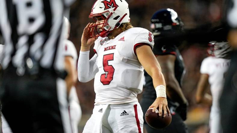 Miami (Oh) RedHawks quarterback Brett Gabbert (5) holds the ball between plays during the NCAA football game between the Cincinnati Bearcats and the Miami RedHawks at Nippert Stadium in Cincinnati on Saturday, Sept. 16, 2023.