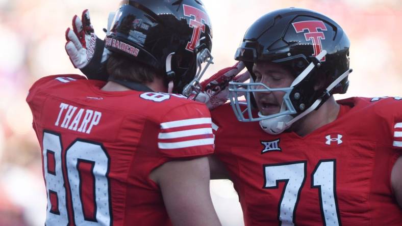 Texas Tech's tight end Mason Tharp (80) and Texas Tech's offensive lineman Monroe Mills (71) celebrate a touchdown against Tartleton State in a non-conference football game, Saturday, Sept. 16, 2023, at Jones AT&T Stadium.