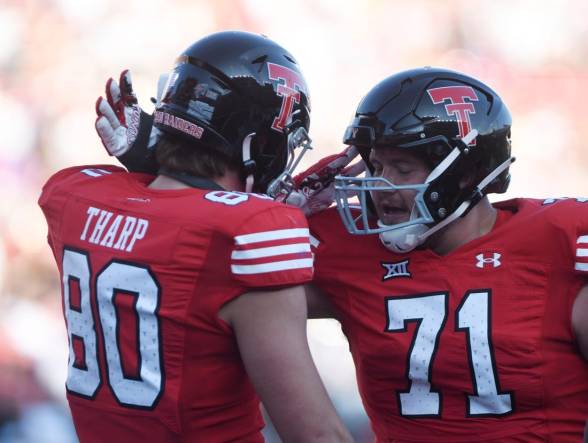 Texas Tech's tight end Mason Tharp (80) and Texas Tech's offensive lineman Monroe Mills (71) celebrate a touchdown against Tartleton State in a non-conference football game, Saturday, Sept. 16, 2023, at Jones AT&T Stadium.