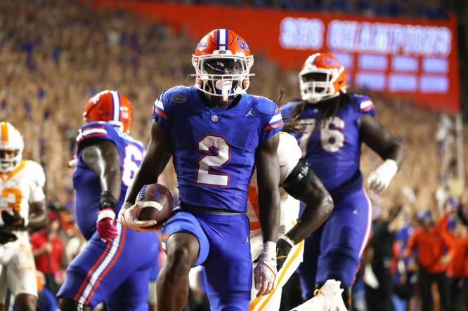 Sep 16, 2023; Gainesville, Florida, USA; Florida Gators running back Montrell Johnson Jr. (2) runs the ball in for a touchdown against the Tennessee Volunteers  during the second quarter at Ben Hill Griffin Stadium. Mandatory Credit: Kim Klement Neitzel-USA TODAY Sports