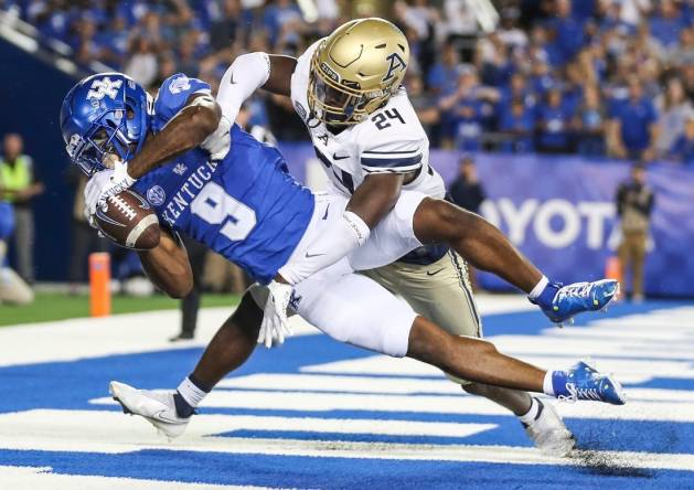 Kentucky Wildcats wide receiver Tayvion Robinson (9) makes a late second quarter touchdown catch over Akron Zips cornerback Darrian Lewis (24) to put the Cats up by two touchdowns in the first half in Saturday's game at Kroger Field in Lexington. Sept. 16, 2023