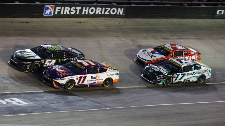 Sep 16, 2023; Bristol, Tennessee, USA; NASCAR Cup Series driver Ty Gibbs (54) and driver Denny Hamlin (11) during the Bass Pro Shops Night Race at Bristol Motor Speedway. Mandatory Credit: Randy Sartin-USA TODAY Sports