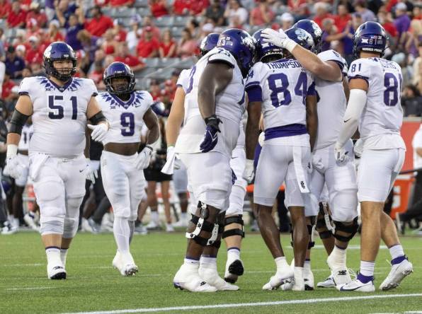 Sep 16, 2023; Houston, Texas, USA; TCU Horned Frogs wide receiver Warren Thompson (84) celebrates his touchdown with teammates against the Houston Cougars in the first half at TDECU Stadium. Mandatory Credit: Thomas Shea-USA TODAY Sports