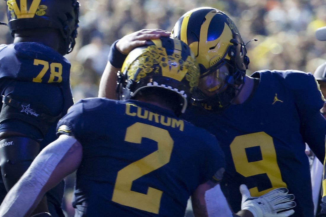 Sep 16, 2023; Ann Arbor, Michigan, USA;  Michigan Wolverines running back Blake Corum (2) celebrates with quarterback J.J. McCarthy (9) after scoring a touchdown against the Bowling Green Falcons in the first half at Michigan Stadium. Mandatory Credit: Rick Osentoski-USA TODAY Sports