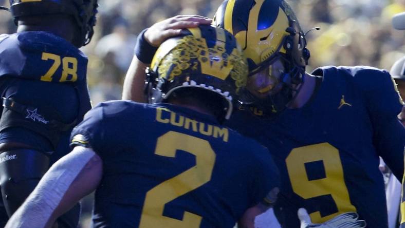 Sep 16, 2023; Ann Arbor, Michigan, USA;  Michigan Wolverines running back Blake Corum (2) celebrates with quarterback J.J. McCarthy (9) after scoring a touchdown against the Bowling Green Falcons in the first half at Michigan Stadium. Mandatory Credit: Rick Osentoski-USA TODAY Sports