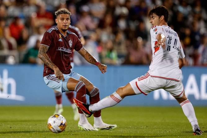 Sep 16, 2023; Commerce City, Colorado, USA; Colorado Rapids forward Rafael Navarro (9) passes the ball as New England Revolution midfielder Ian Harkes (14) defends in the first half at Dick's Sporting Goods Park. Mandatory Credit: Isaiah J. Downing-USA TODAY Sports