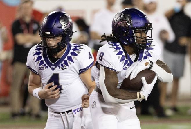 Sep 16, 2023; Houston, Texas, USA; TCU Horned Frogs quarterback Chandler Morris (4) hands the ball off to running back Emani Bailey (9) against the Houston Cougars in the first half at TDECU Stadium. Mandatory Credit: Thomas Shea-USA TODAY Sports