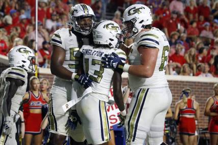 Sep 16, 2023; Oxford, Mississippi, USA; Georgia Tech Yellow Jackets wide receiver Eric Singleton, Jr. (13) reacts with offensive linemen Jordan Williams (54) and Connor Scaglione (65) during the second half against the Mississippi Rebels at Vaught-Hemingway Stadium. Mandatory Credit: Petre Thomas-USA TODAY Sports