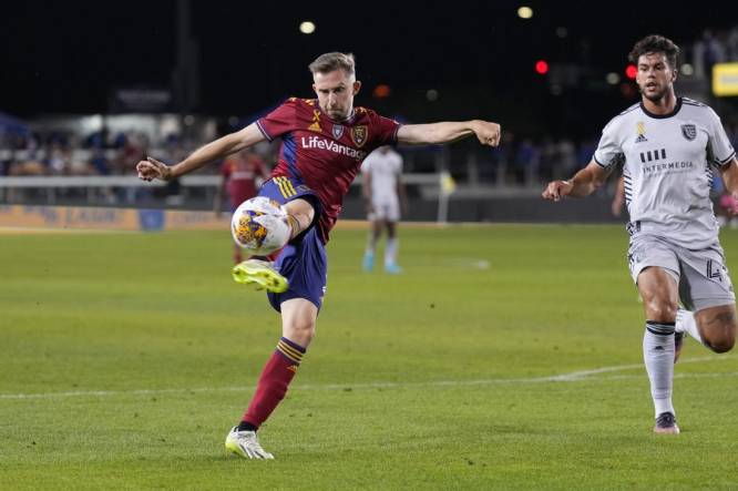 Sep 16, 2023; San Jose, California, USA; Real Salt Lake defender Andrew Brody (center) attempts a shot against the San Jose Earthquakes during the first half at PayPal Park. Mandatory Credit: Darren Yamashita-USA TODAY Sports