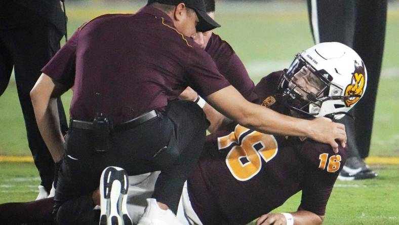 Arizona State Sun Devils quarterback Trenton Bourguet (16) grimaces after an ankle injury that forced him to leave the game against the Fresno State Bulldogs in the first half at Mountain America Stadium in Tempe on Sept. 16, 2023.