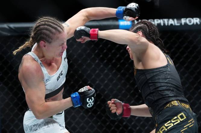 Sep 16, 2023; Las Vegas, Nevada, USA; Alexa Grasso (red gloves) fights Valentina Shevchenko (blue gloves) during UFC Fight Night at T-Mobile Arena. Mandatory Credit: Stephen R. Sylvanie-USA TODAY Sports