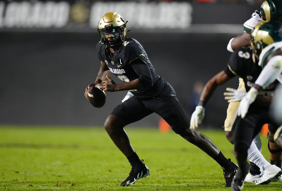 Sep 16, 2023; Boulder, Colorado, USA; Colorado Buffaloes quarterback Shedeur Sanders (2) scrambles in double overtime against the Colorado State Rams at Folsom Field. Mandatory Credit: Ron Chenoy-USA TODAY Sports