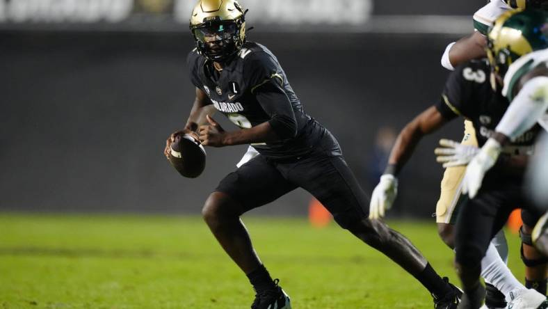 Sep 16, 2023; Boulder, Colorado, USA; Colorado Buffaloes quarterback Shedeur Sanders (2) scrambles in double overtime against the Colorado State Rams at Folsom Field. Mandatory Credit: Ron Chenoy-USA TODAY Sports