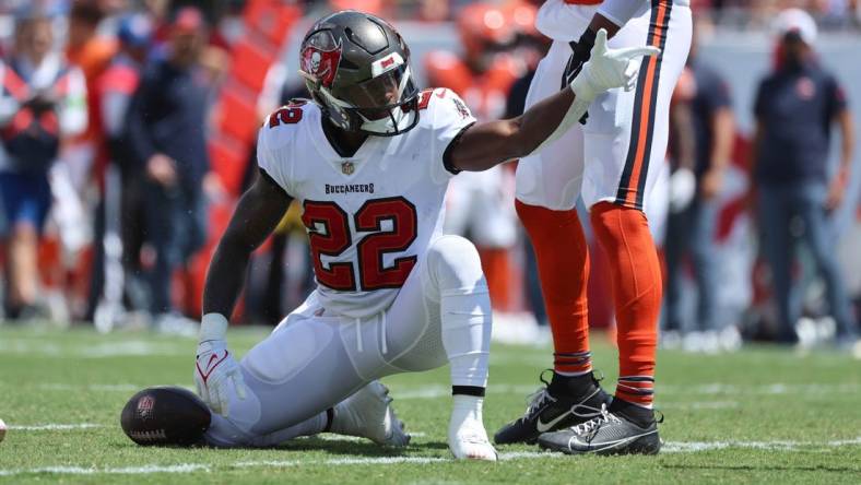 Sep 17, 2023; Tampa, Florida, USA; Tampa Bay Buccaneers running back Chase Edmonds (22) reacts as he gets a first down against the Chicago Bears during the first quarter at Raymond James Stadium. Mandatory Credit: Kim Klement Neitzel-USA TODAY Sports