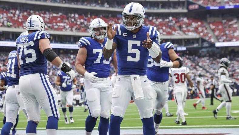 Sep 17, 2023; Houston, Texas, USA; Indianapolis Colts quarterback Anthony Richardson (5) celebrates after scoring a touchdown during the first quarter against the Houston Texans at NRG Stadium. Mandatory Credit: Troy Taormina-USA TODAY Sports