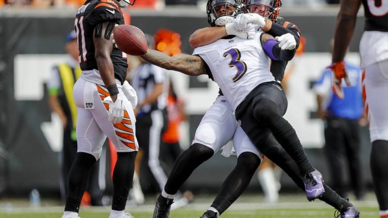 Sep 17, 2023; Cincinnati, Ohio, USA; Baltimore Ravens wide receiver Odell Beckham Jr. (3) runs with the ball against Cincinnati Bengals linebacker Logan Wilson (55) in the first half at Paycor Stadium. Mandatory Credit: Katie Stratman-USA TODAY Sports