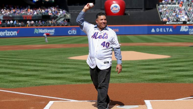 Sep 17, 2023; New York City, New York, USA; New York Mets former pitcher Bartolo Colon waves after throwing out a ceremonial first pitch before a game against the Cincinnati Reds at Citi Field. Colon today retired from baseball as a Met. Mandatory Credit: Brad Penner-USA TODAY Sports