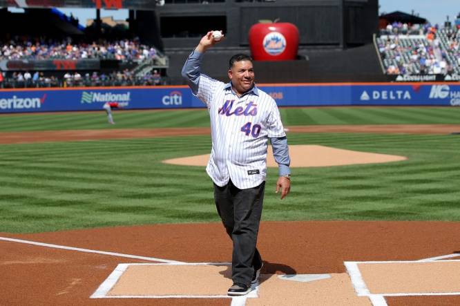 Sep 17, 2023; New York City, New York, USA; New York Mets former pitcher Bartolo Colon waves after throwing out a ceremonial first pitch before a game against the Cincinnati Reds at Citi Field. Colon today retired from baseball as a Met. Mandatory Credit: Brad Penner-USA TODAY Sports
