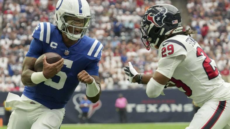 Sep 17, 2023; Houston, Texas, USA; Houston Texans safety M.J. Stewart (29) tries to tackle Indianapolis Colts quarterback Anthony Richardson (5) as he rushes in a touchdown Sunday, Sept. 17, 2023, during a game against the Houston Texans at NRG Stadium. Mandatory Credit: Jenna Watson-USA TODAY Sports