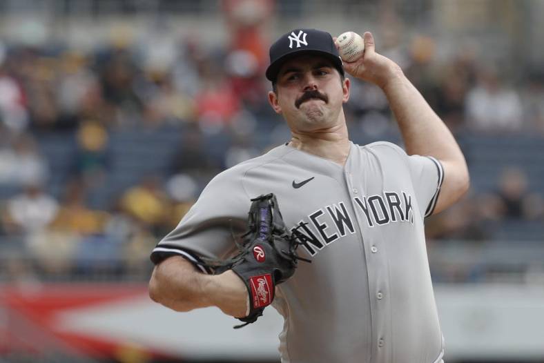 Sep 17, 2023; Pittsburgh, Pennsylvania, USA; New York Yankees starting pitcher Carlos Rodon (55) throws a pitch against the Pittsburgh Pirates during the first inning at PNC Park. Mandatory Credit: Charles LeClaire-USA TODAY Sports