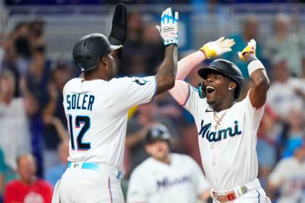 Sep 17, 2023; Miami, Florida, USA; Miami Marlins center fielder Jazz Chisholm Jr. (2) celebrates with Miami Marlins designated hitter Jorge Soler (12) after hitting a grand slam against the Atlanta Braves at loanDepot Park. Mandatory Credit: Rich Storry-USA TODAY Sports
