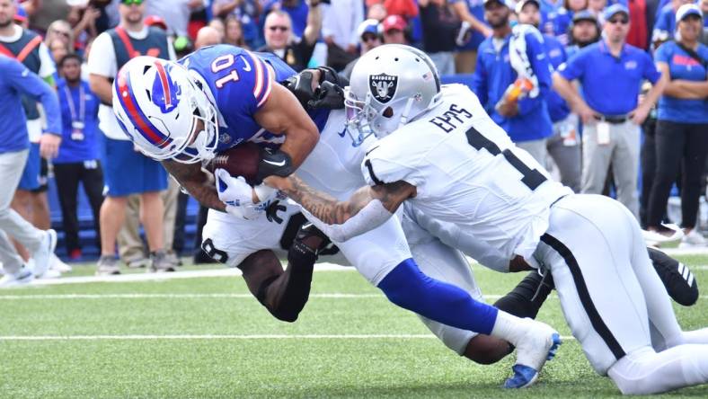 Sep 17, 2023; Orchard Park, New York, USA; Buffalo Bills wide receiver Khalil Shakir (10) scores a touchdown as he is tackled by Las Vegas Raiders safety Marcus Epps (1) in the second quarter at Highmark Stadium. Mandatory Credit: Mark Konezny-USA TODAY Sports