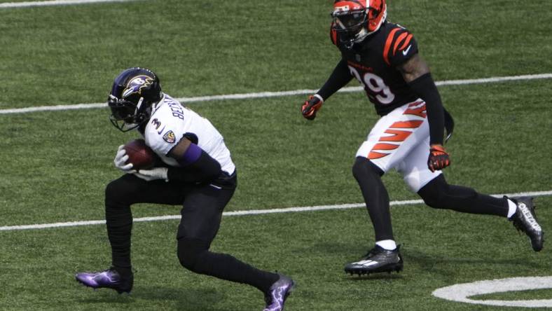 Sep 17, 2023; Cincinnati, Ohio, USA; Baltimore Ravens wide receiver Odell Beckham Jr. (3) completes a catch as Cincinnati Bengals cornerback Cam Taylor-Britt (29) defends in the first quarter at Paycor Stadium. Mandatory Credit: Cara Owsley-USA TODAY Sports