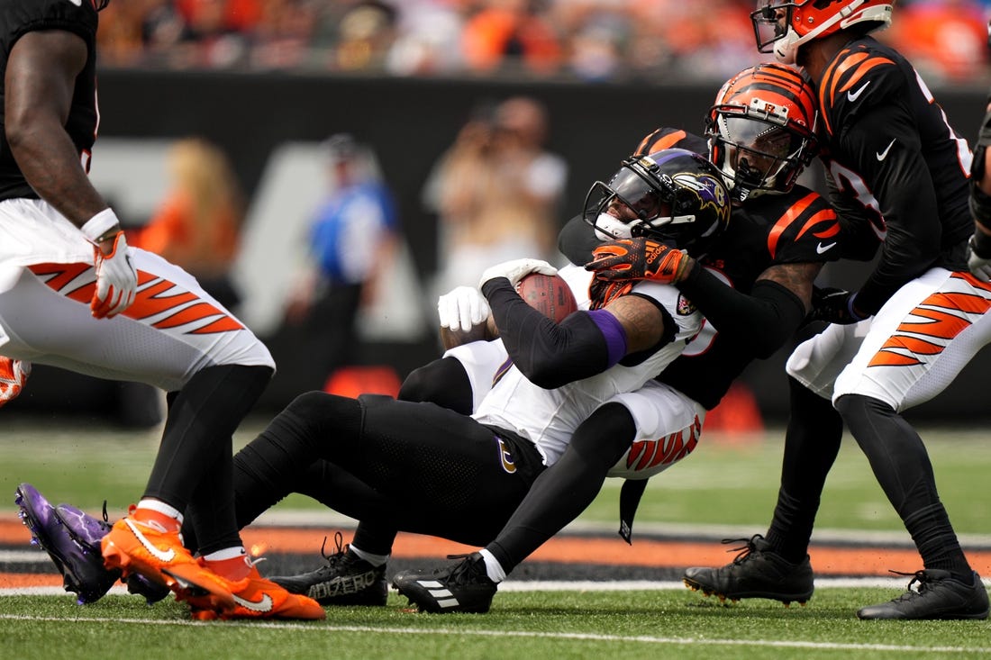 Sep 17, 2023; Cincinnati, Ohio, USA; Cincinnati Bengals cornerback Cam Taylor-Britt (29) tackles Baltimore Ravens wide receiver Odell Beckham Jr. (3) in the first quarter at Paycor Stadium. Mandatory Credit: Albert Cesare-USA TODAY Sports