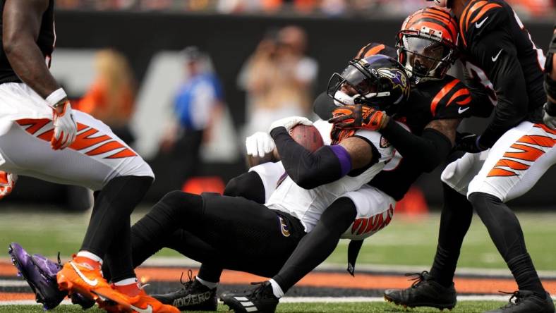 Sep 17, 2023; Cincinnati, Ohio, USA; Cincinnati Bengals cornerback Cam Taylor-Britt (29) tackles Baltimore Ravens wide receiver Odell Beckham Jr. (3) in the first quarter at Paycor Stadium. Mandatory Credit: Albert Cesare-USA TODAY Sports