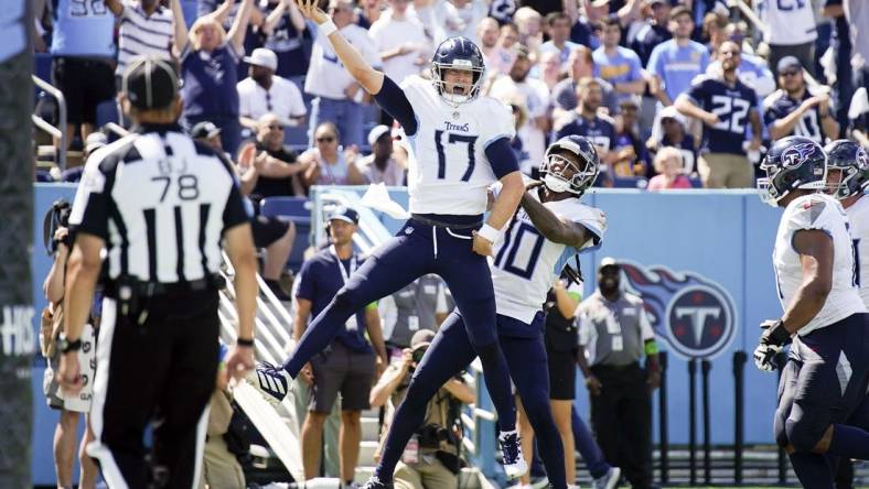 Sep 17, 2023; Nashville, Tennessee, USA; Tennessee Titans quarterback Ryan Tannehill (17) celebrates his touchdown in the third quarter at Nissan Stadium. Mandatory Credit: Denny Simmons-USA TODAY Sports