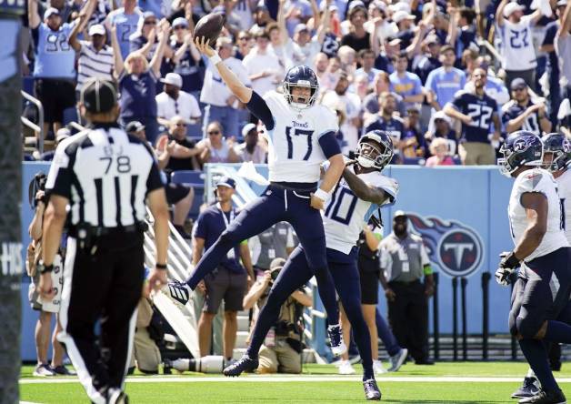 Sep 17, 2023; Nashville, Tennessee, USA; Tennessee Titans quarterback Ryan Tannehill (17) celebrates his touchdown in the third quarter at Nissan Stadium. Mandatory Credit: Denny Simmons-USA TODAY Sports