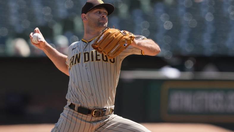 Sep 17, 2023; Oakland, California, USA; San Diego Padres starting pitcher Nick Martinez (21) throws a pitch against the Oakland Athletics during the first inning at Oakland-Alameda County Coliseum. Mandatory Credit: Darren Yamashita-USA TODAY Sports