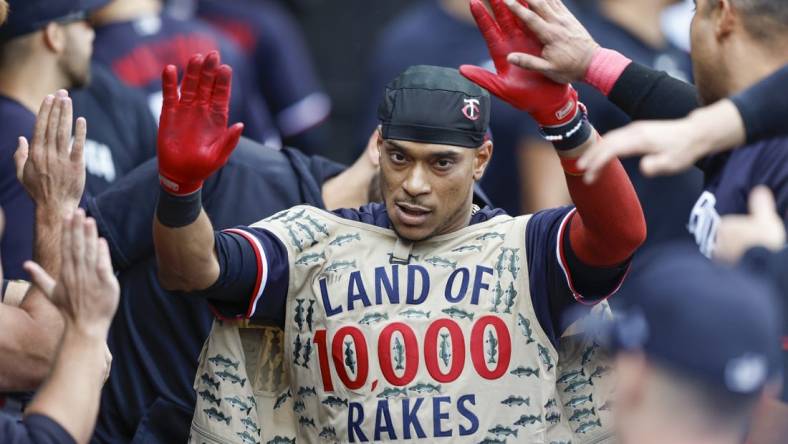 Sep 17, 2023; Chicago, Illinois, USA; Minnesota Twins second baseman Jorge Polanco (11) celebrates with teammates in the dugout after hitting a solo home run against the Chicago White Sox during the eight inning at Guaranteed Rate Field. Mandatory Credit: Kamil Krzaczynski-USA TODAY Sports