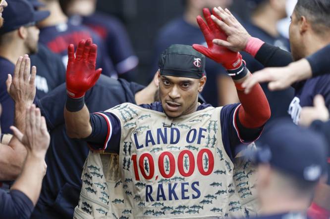 Sep 17, 2023; Chicago, Illinois, USA; Minnesota Twins second baseman Jorge Polanco (11) celebrates with teammates in the dugout after hitting a solo home run against the Chicago White Sox during the eight inning at Guaranteed Rate Field. Mandatory Credit: Kamil Krzaczynski-USA TODAY Sports
