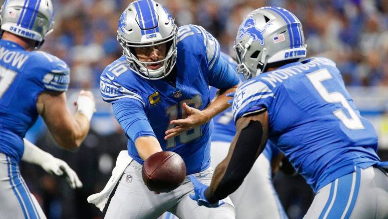 Detroit Lions quarterback Jared Goff (16) hands the ball to running back David Montgomery (5) against Seattle Seahawks during the first half at Ford Field in Detroit on Sunday, Sept. 17, 2023.